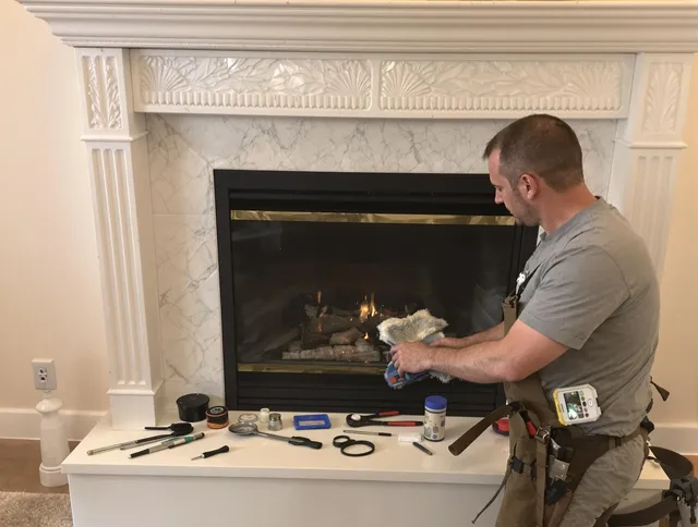 Glocester Chimney Sweep performing fireplace maintenance in Glocester, RI
