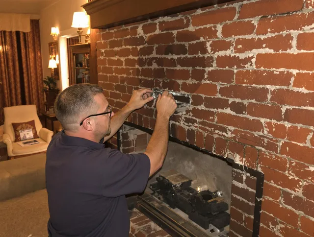 Glocester Chimney Sweep expert fixing a fireplace in Glocester, RI